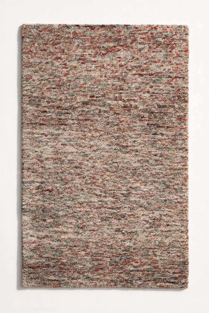 a canyon hand-tufted wool rug with heathered rust, grey and cream flecks shown from above