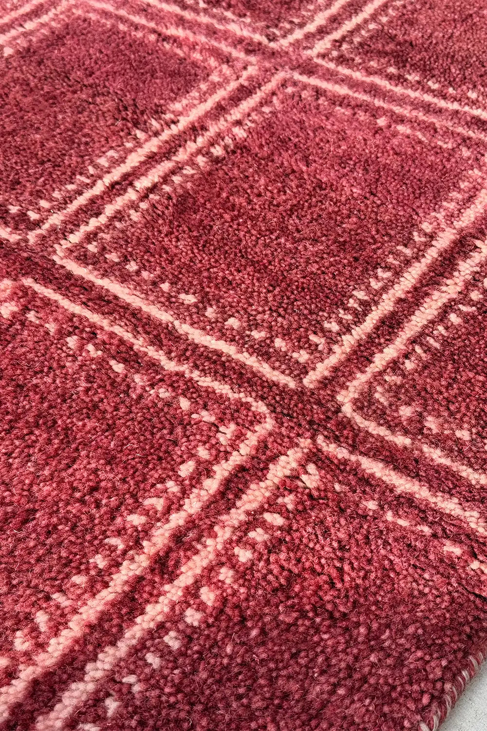 Modern red geometric area rug with clean box patterns, hand-knotted from wool