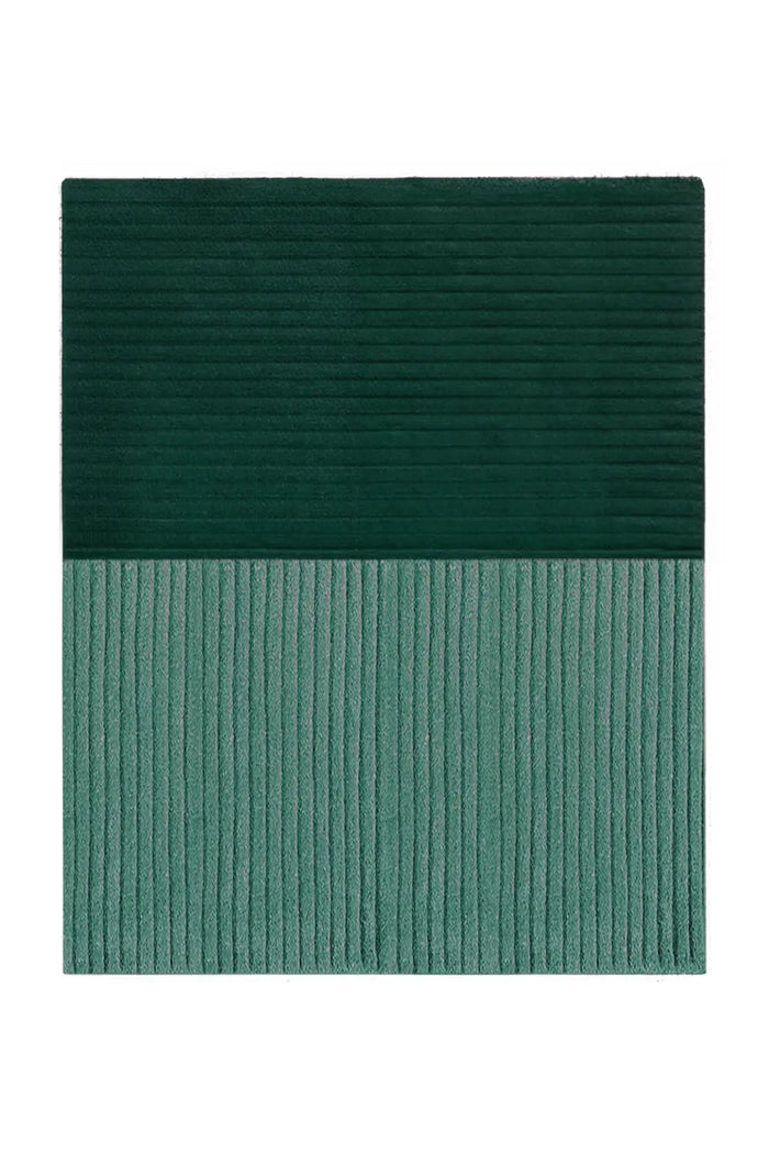 teal green area rug with bold ridge texture, perfect for adding warmth to a living room