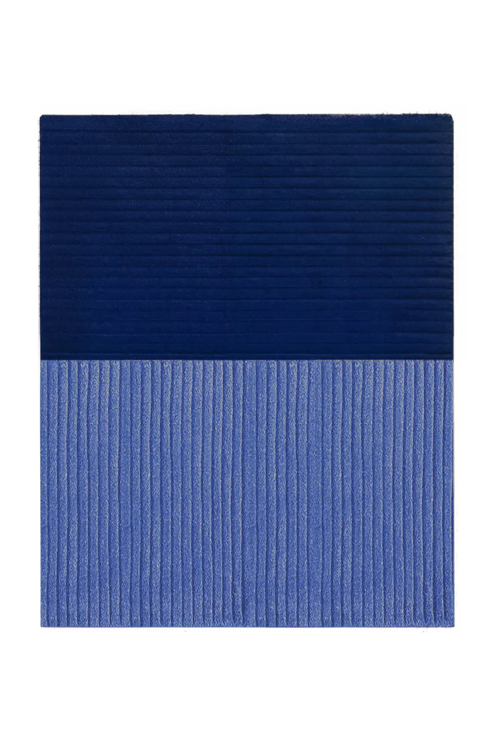 Hand-tufted wool rug in navy blue and light blue, perfect for styling a modern living room