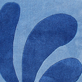 Modern blue tufted rug with organic shapes, ideal for 6x9 or 8x10 area rugs in coastal rooms
