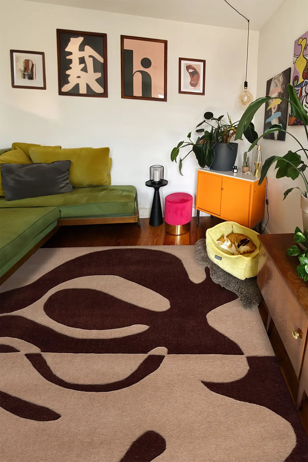 Brown abstract rug with organic shapes, shown in a boho eclectic living room great for neutral 9x12 area rugs