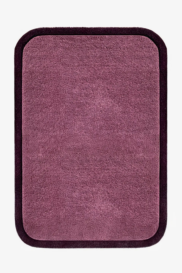 5x7 plum purple wool rug with sculptural rounded edges and deep purple border