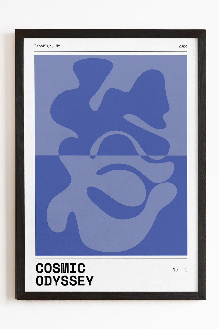 Framed Cosmic Odyssey art print featuring deep blue abstract shapes on a minimalist design.