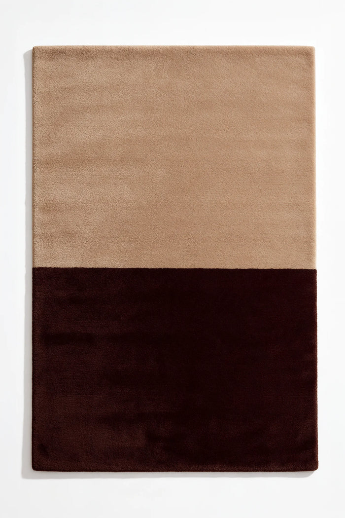 Soft neutral tan and deep brown wool rug, a warm modern addition to bedrooms, home offices, or cozy minimalist homes hazelnut
