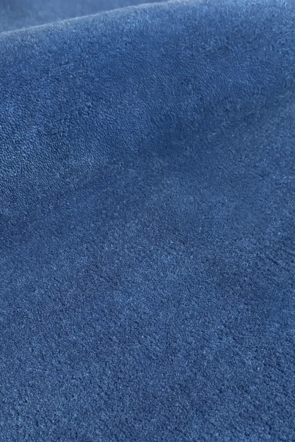blue hand tufted wool rug with plush texture