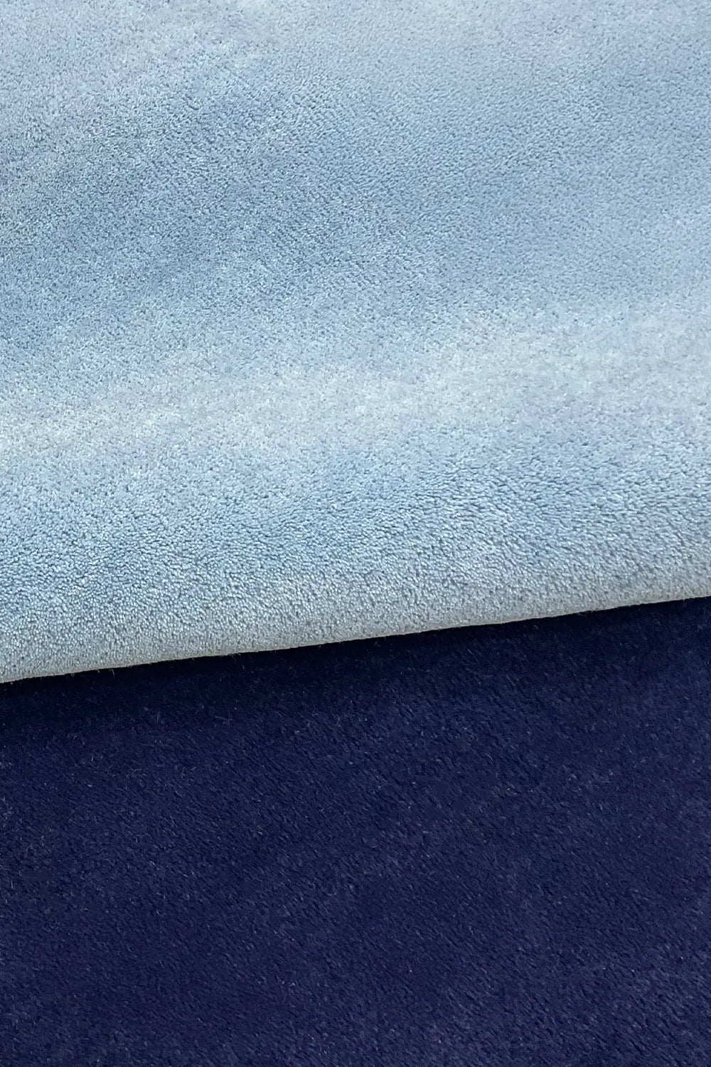 light blue and navy tufted wool rug with soft durable plush texture