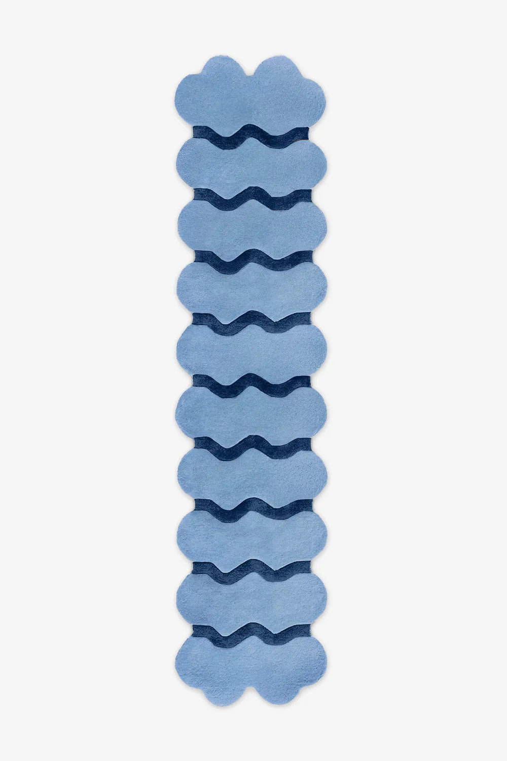 Extra long sculptural blue wool runner with navy waves, ideal for colorful hallway styling