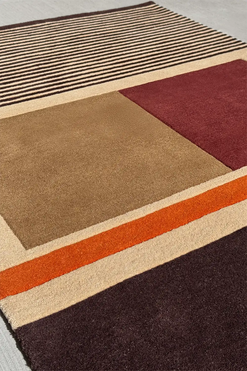 Textured striped wool rug in brown and tan with soft contrast and depth