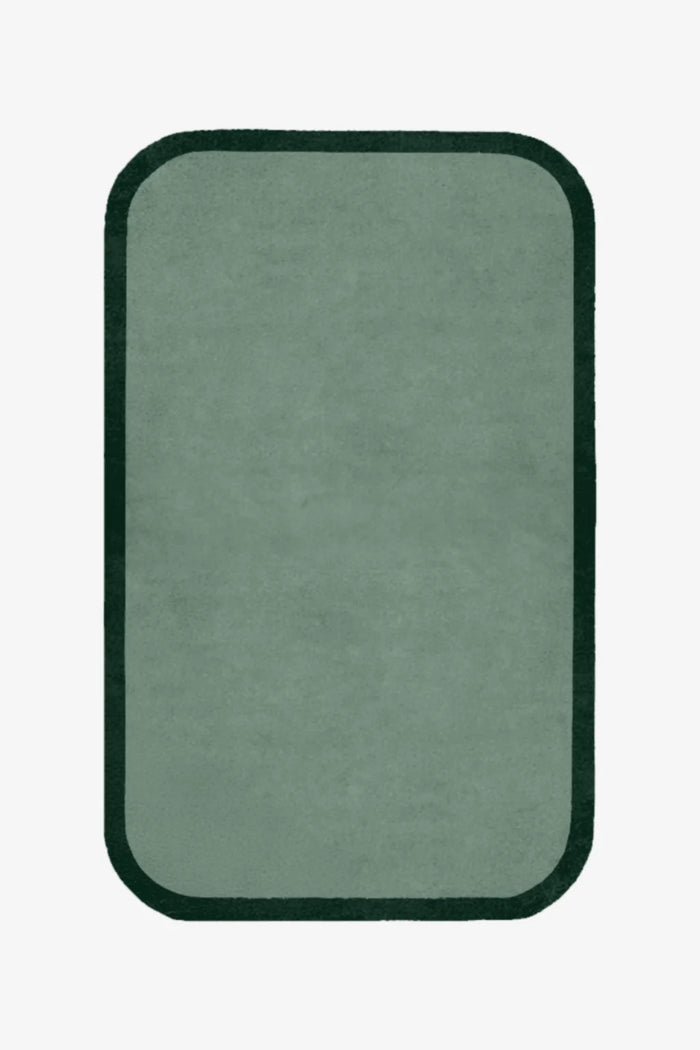 Rectangular green rug with a black border on a white background