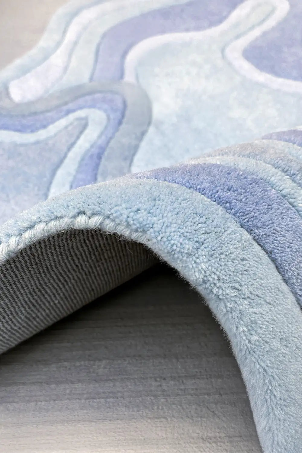 Contemporary hand-tufted rug in soft sky blue wool with thick plush pile