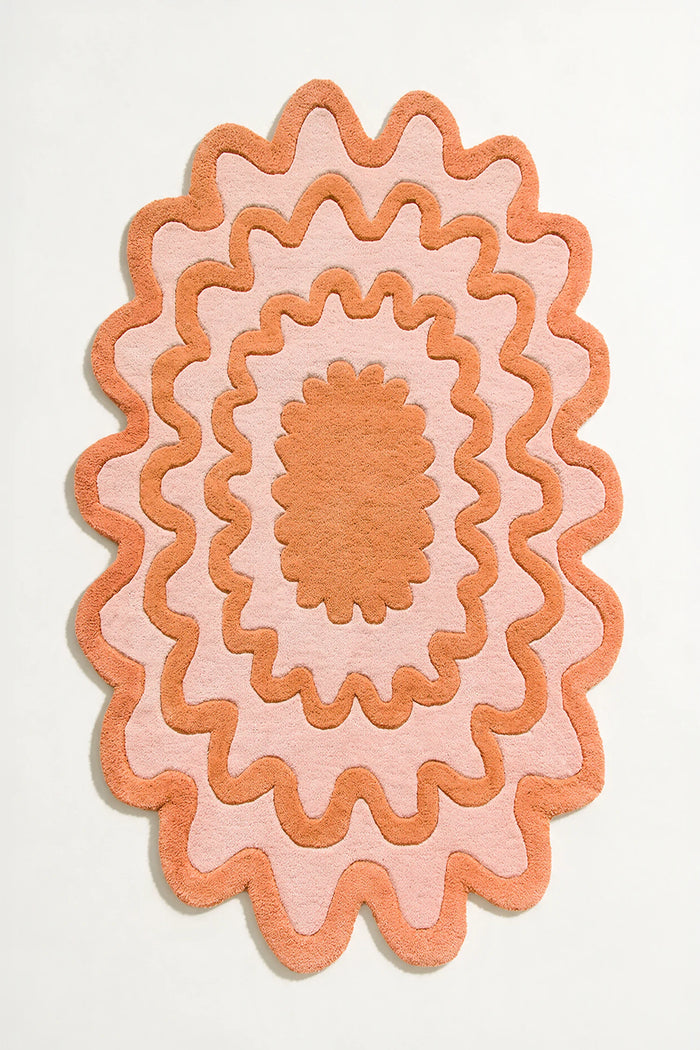 8x10 orange ripple oval wool rug with scalloped edges, abstract boho design on white background