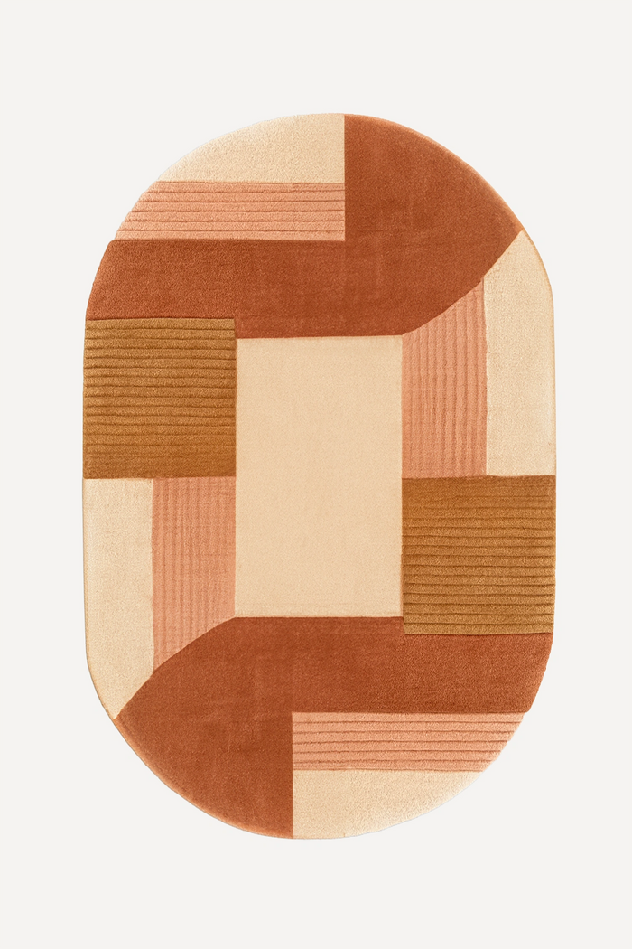 8x10 oval wool rug in terracotta, camel, and cream color blocks with hand-tufted modern geometric design
