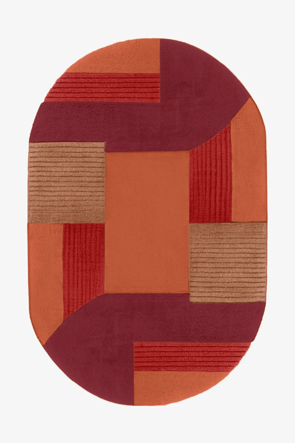 Oval hand-tufted wool rug in red, burgundy, and orange blocks, perfect for bold modern interiors