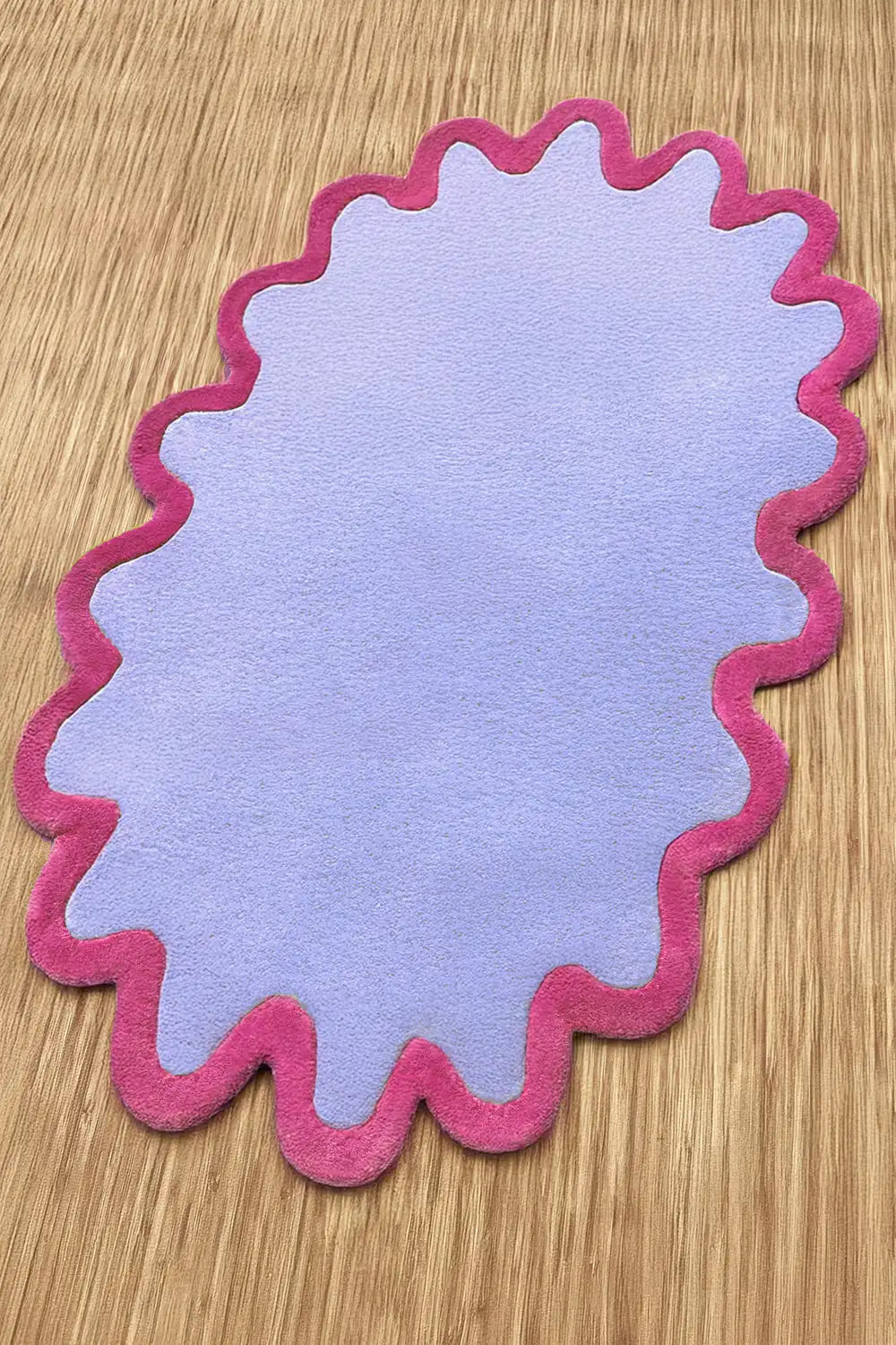 Small 3x5 scalloped wool rug in lilac and pink with wavy modern shape cornflower magenta