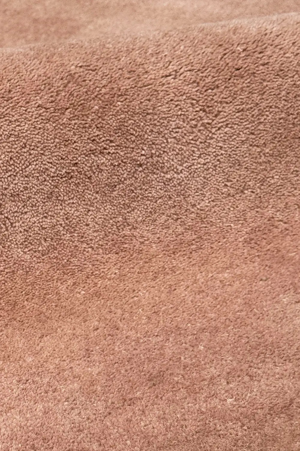 Close-up of brown ripple stripe tufted wool rug, luxurious custom area rug