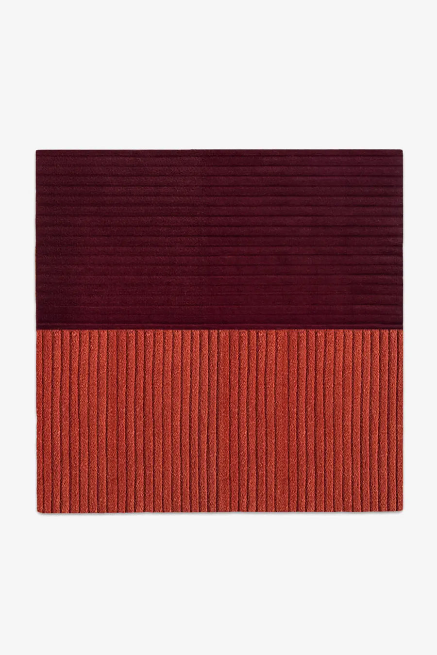 Two-tone red and bunt orange square rug with a ribbed texture on a white background