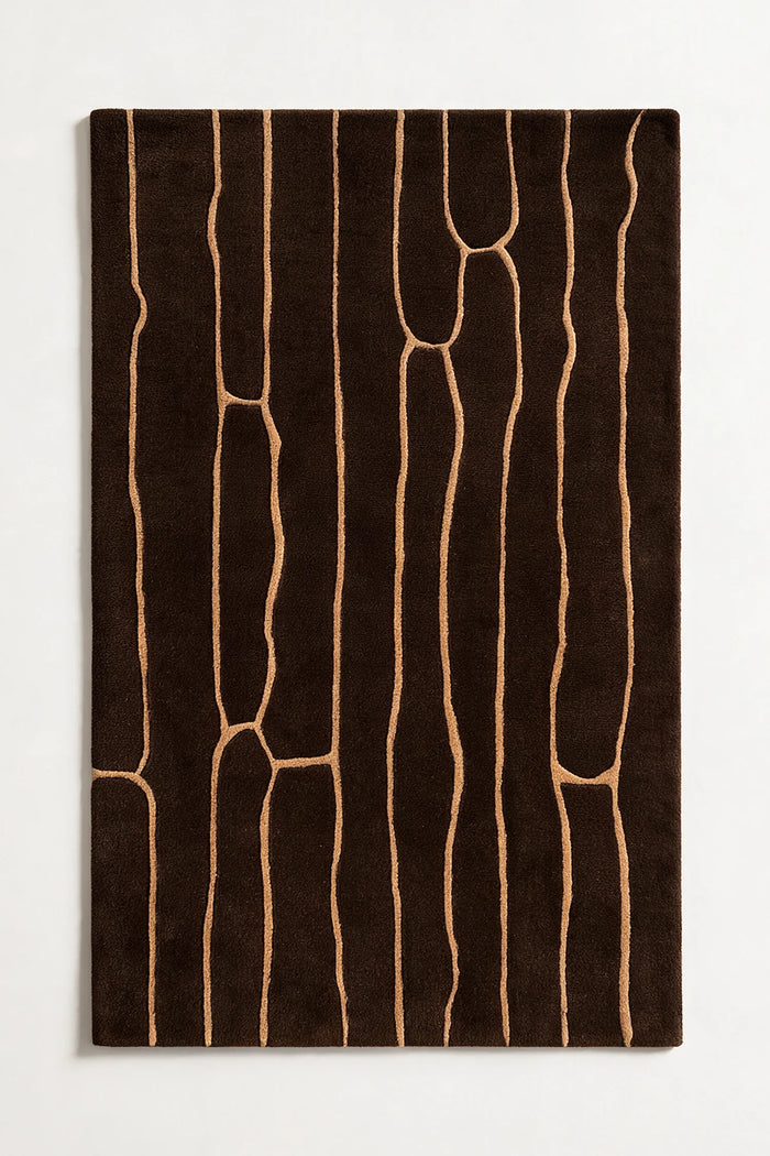 Brown wool rug with abstract beige patterns on a white background