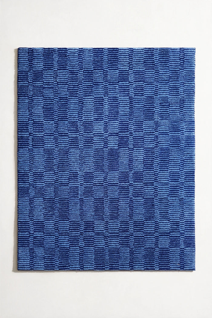 4x5 blue geometric wool rug in a plaid-like checkered pattern with subtle striped texture, perfect for modern living rooms or navy blue bedrooms