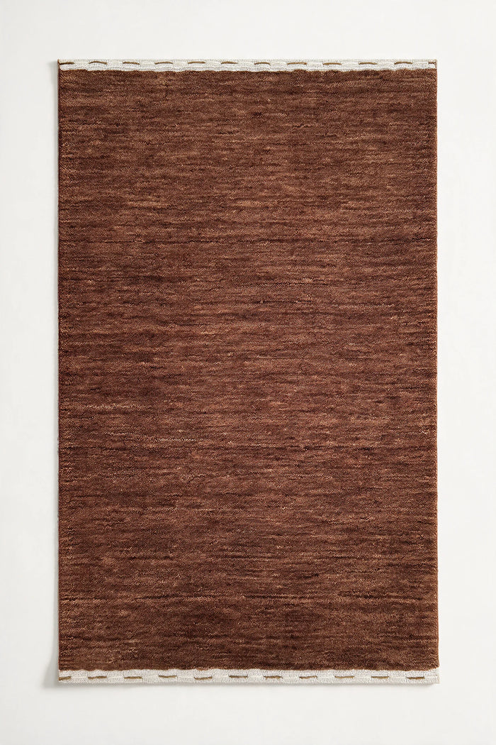 medium brown wool textured rug on a white background chestnut | Haven in Chestnut with stitched binding