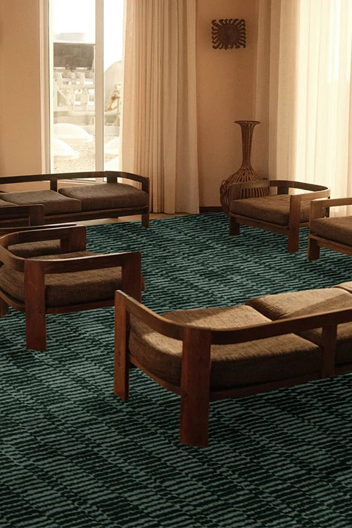 Retro-style living room with wooden furniture and a green patterned rug.