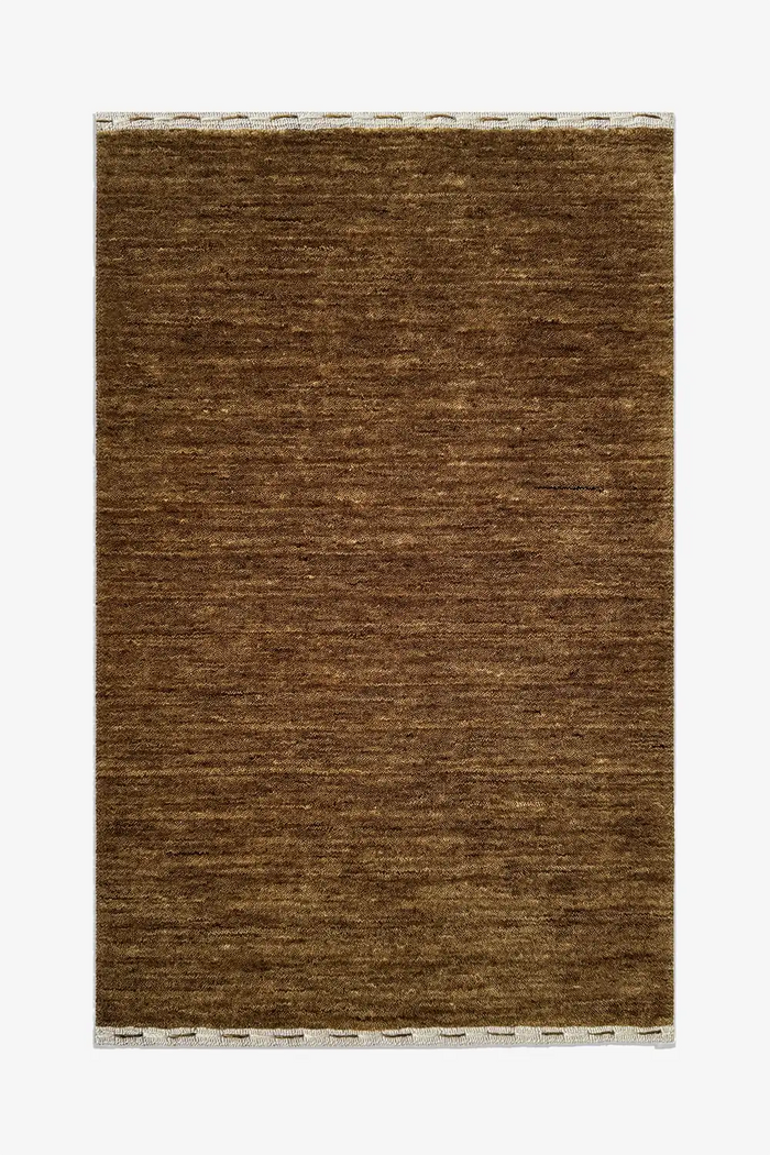 taupe golden brown textured rug on a white background hazel