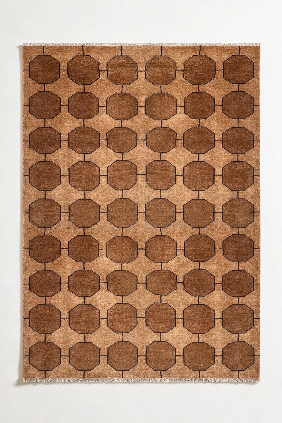 honey gold patterned rug with geometric design on a plain background | 6x9