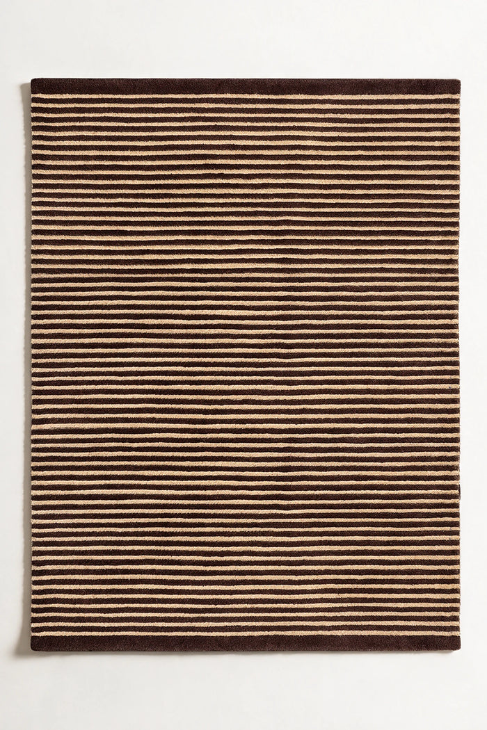 Neutral wool area rug with thin brown and tan stripes in a classic modern pattern