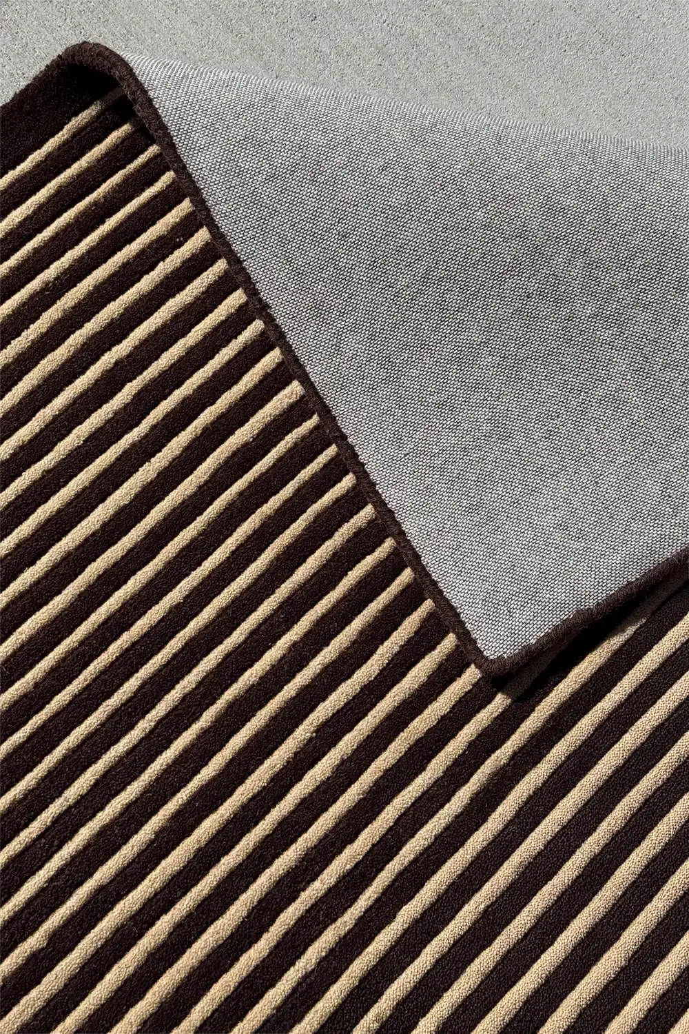Neutral luxury wool rug with modern striped tufted pattern for elevated interiors