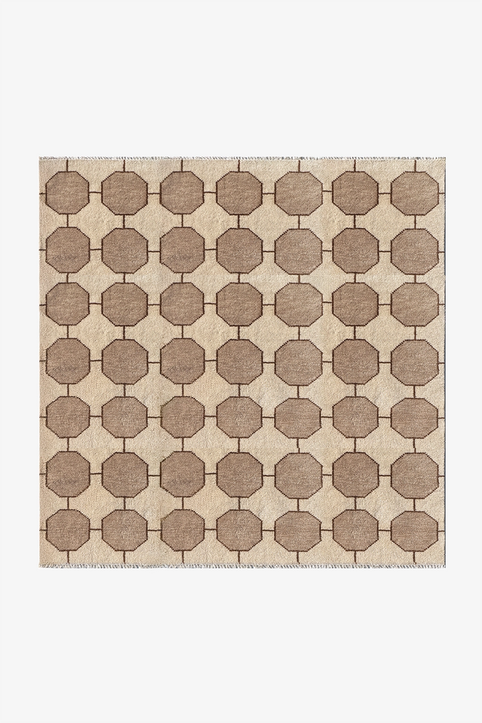 ivory white square patterned rug with geometric design on a plain background | 7x7