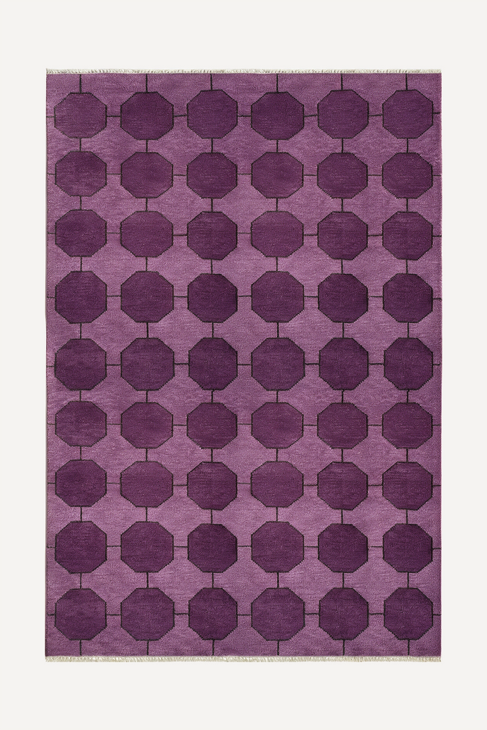 Purple geometric patterned rug made from hand-knotted wool on a white background | 5x8