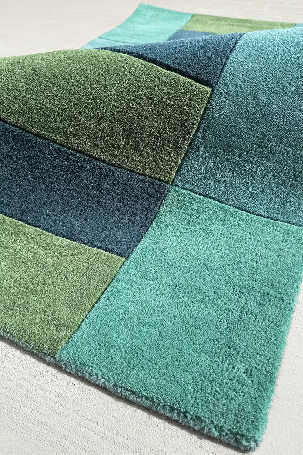 Green and blue striped rug in modern tropical tones, suited for living rooms or bedrooms