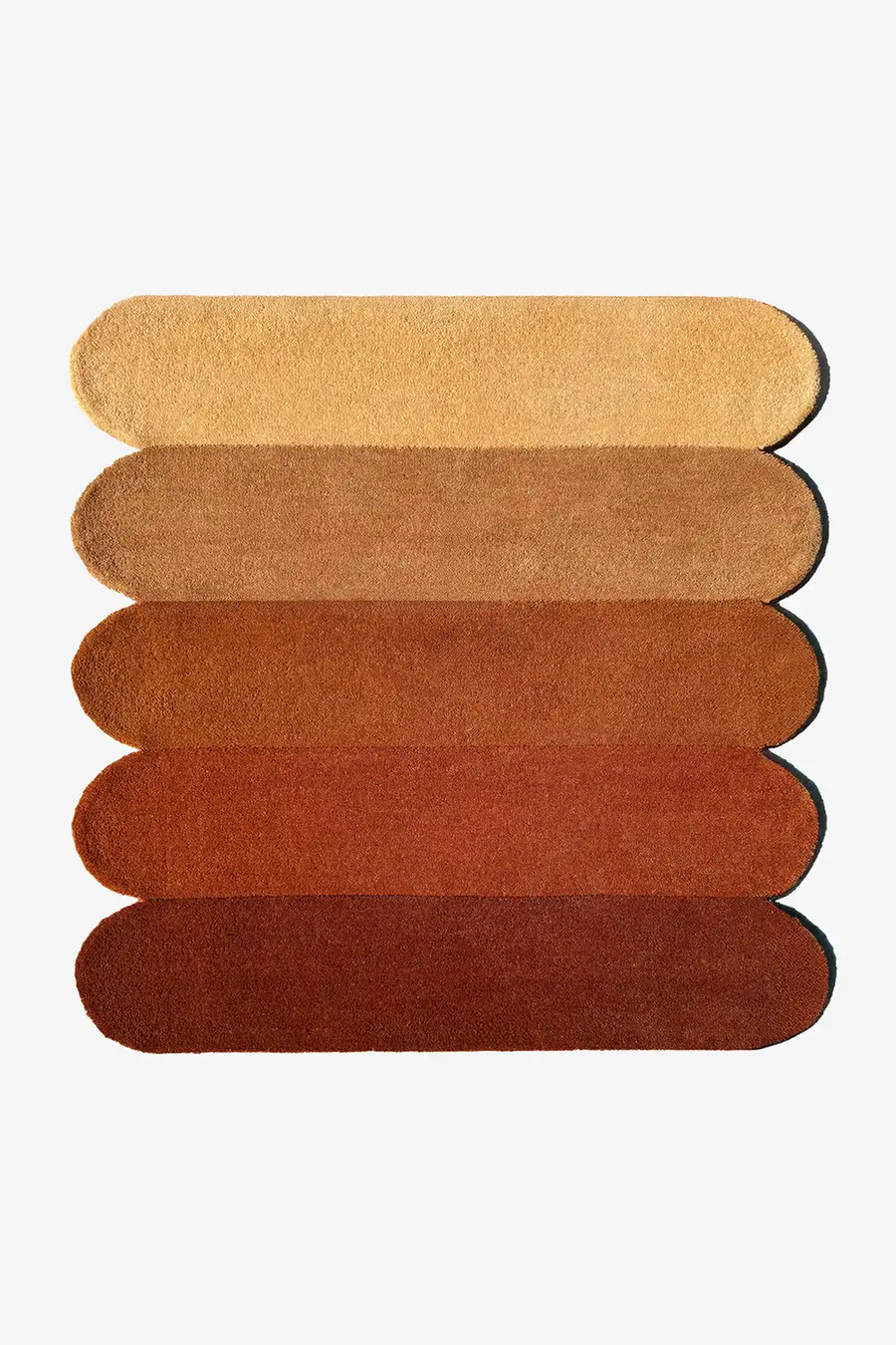 Rug with horizontal stripes in brown and orange shades and scalloped sides on a white background