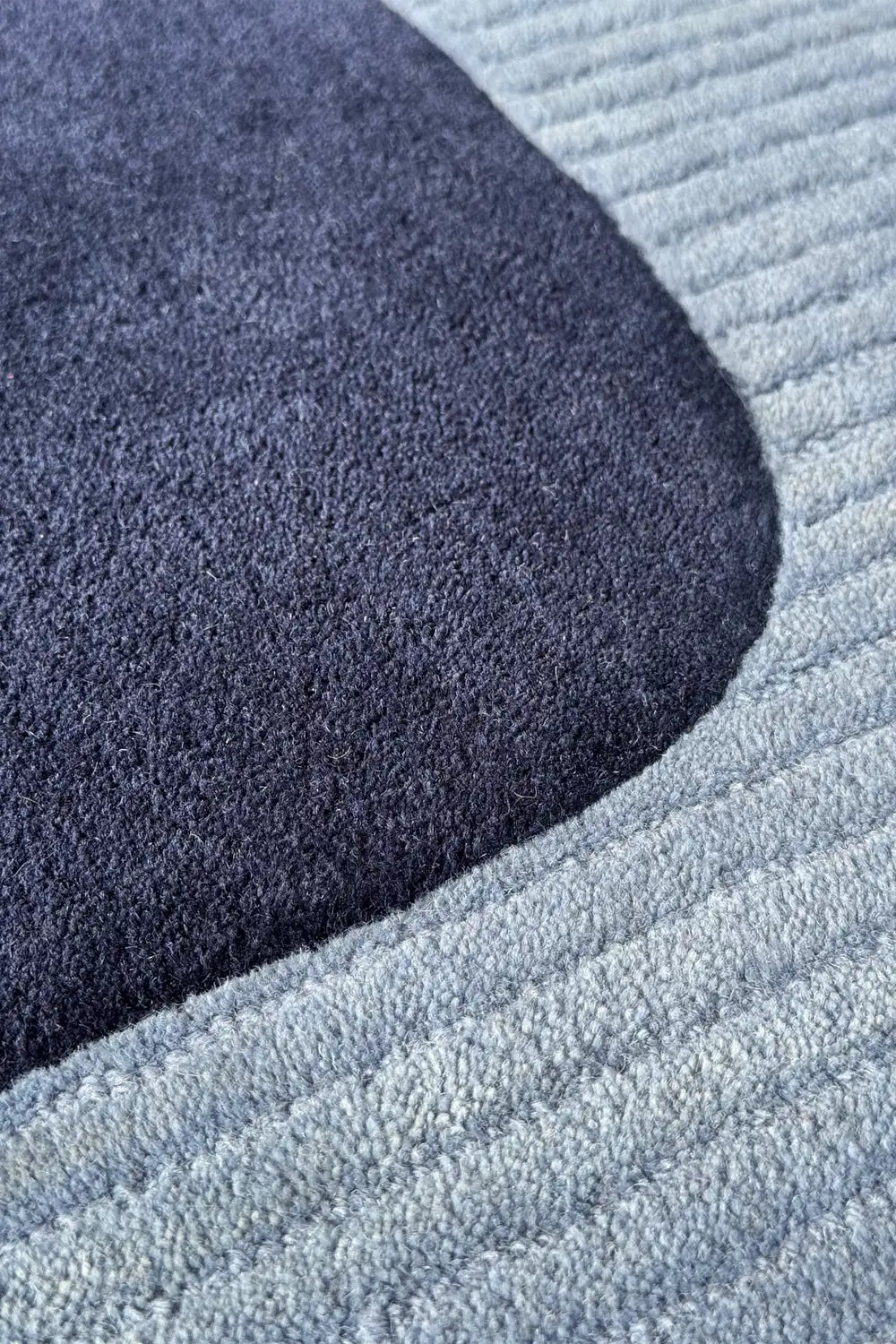 5x7 wool area rug in navy and powder blue with unique textured design