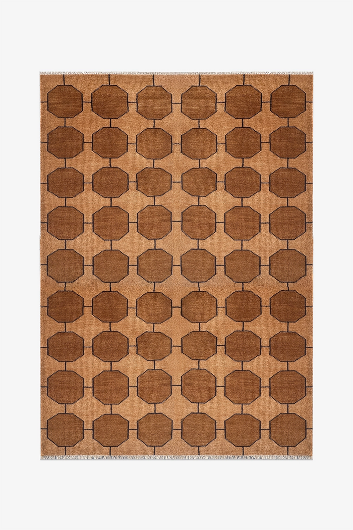 honey gold brown patterned rug with geometric design on a plain background | 6x9