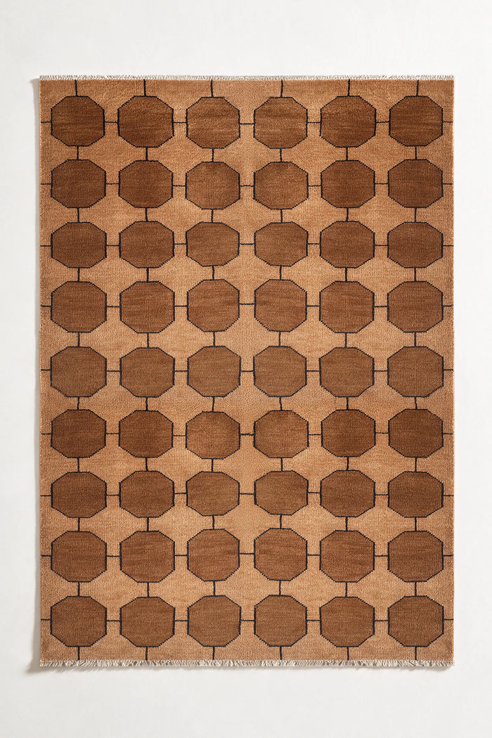 honey gold brown patterned rug with geometric design on a plain background | 6x9