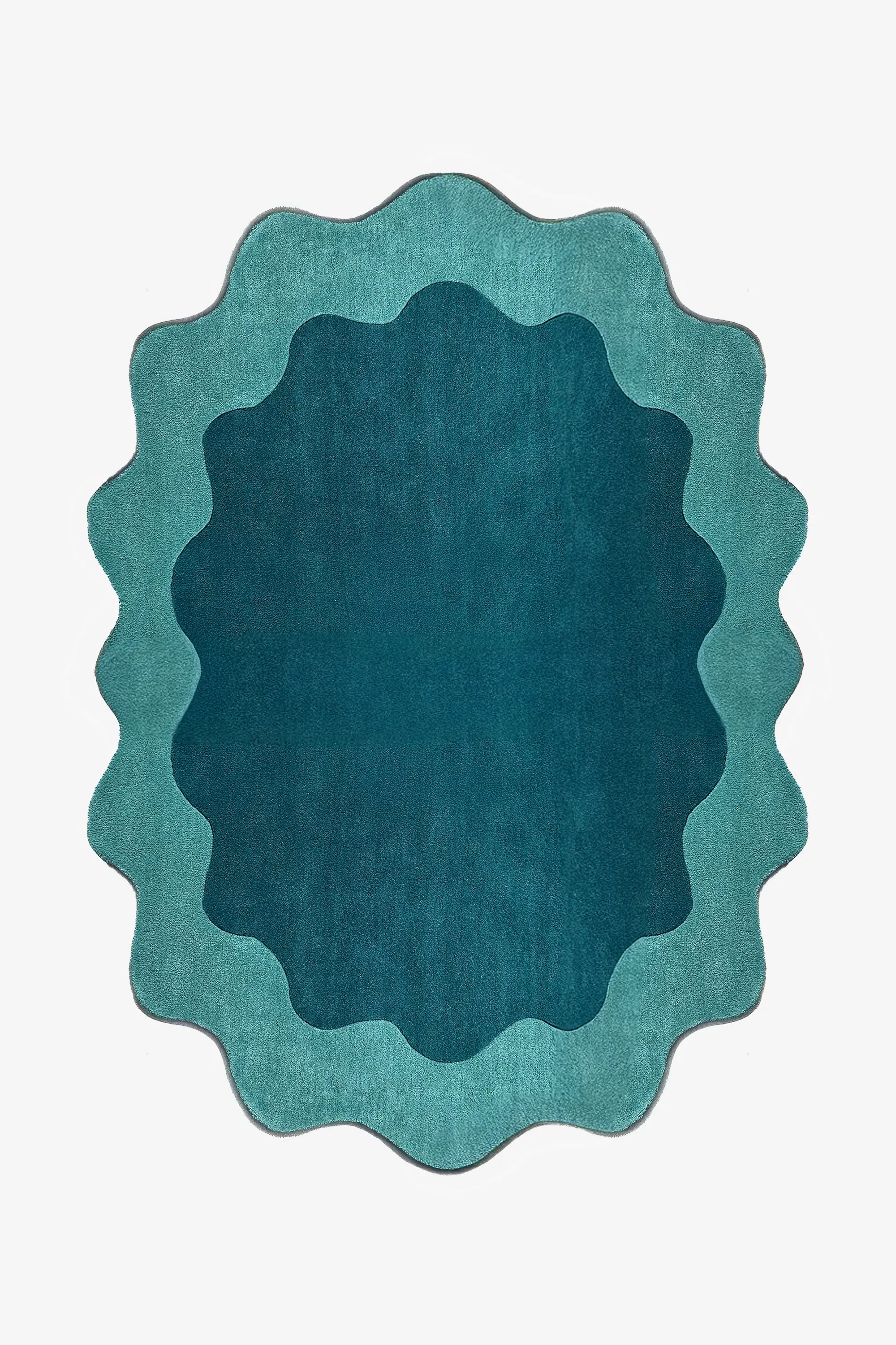 Teal and turquoise scalloped edge rug with abstract curved silhouette, a bold 8x10 oval area rug for living rooms or bedrooms