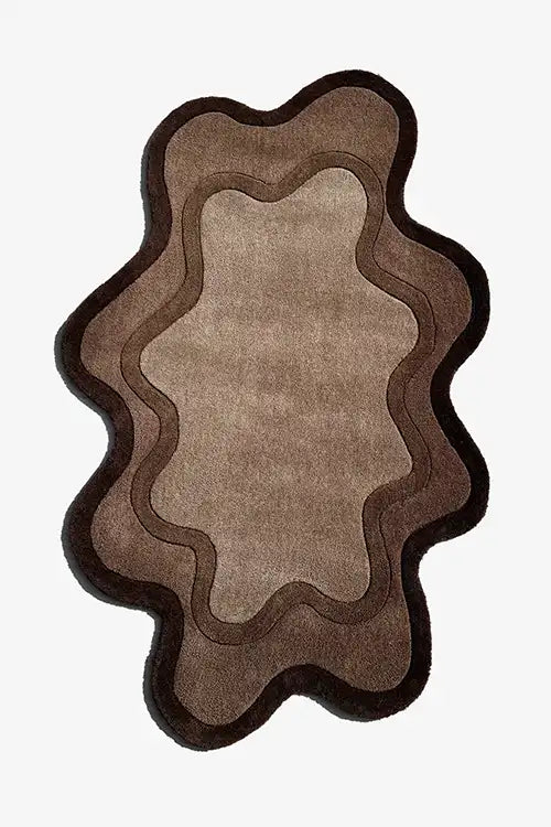 jubi brown irregular shaped rug with dark brown border and organic shape
