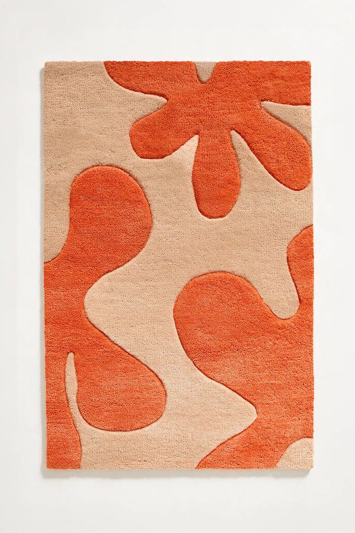 Modern abstract orange and cream wool area rug with playful shapes, shown in 8x10 size
