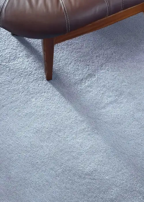Soft baby blue wool rug with subtle texture, a perfect modern area rug for nursery, bedroom, or light-toned spaces