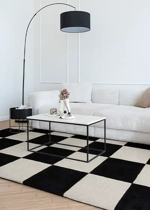 Tufted wool rug with bold black and white checkerboard pattern, great as a 6x9 modern rug or funky custom rug for entryway