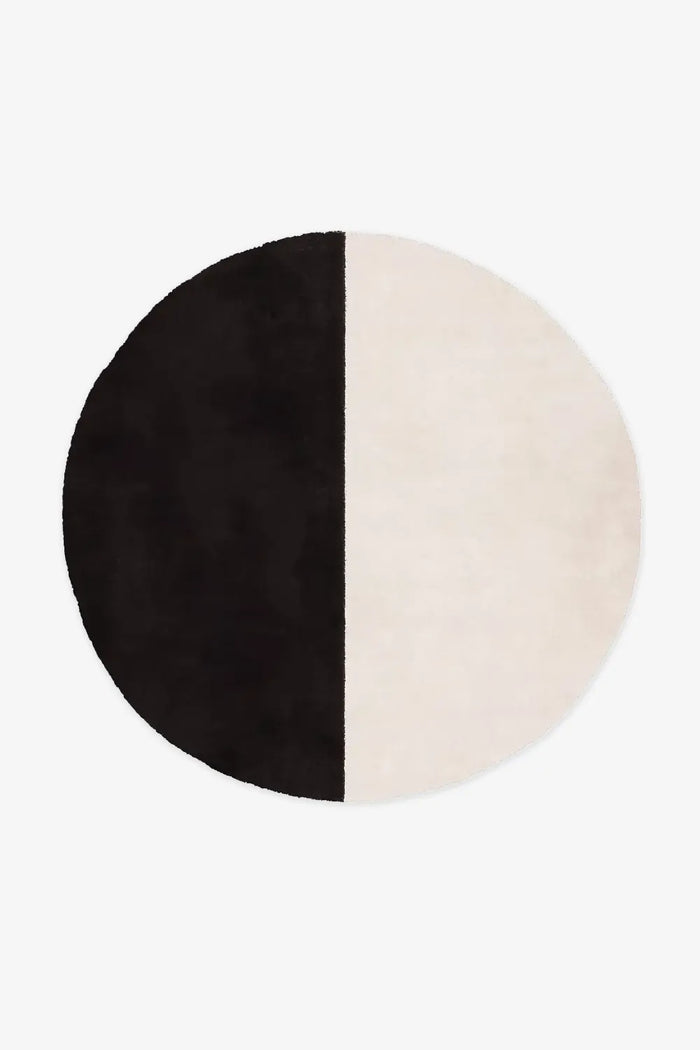 large black and white wool color block round rug for a minimalist setting oreo