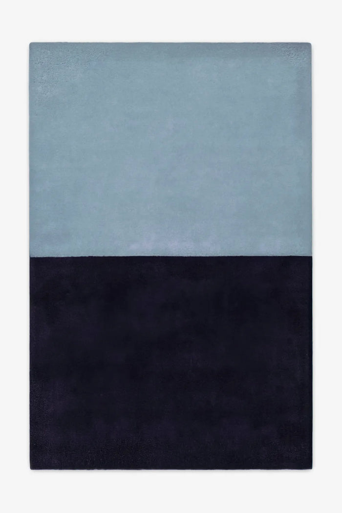 5x8 two-tone wool area rug in light blue and deep navy, perfect for modern bedrooms, serene offices, or minimalist living rooms indigo
