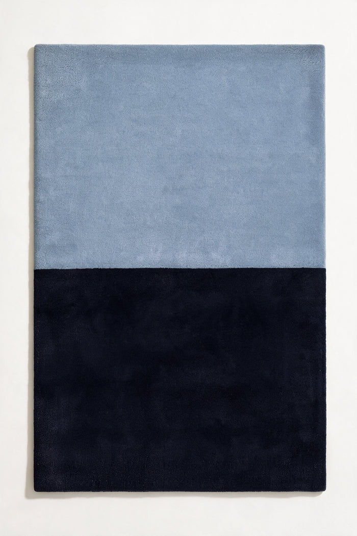 5x8 two-tone wool area rug in light blue and deep navy, perfect for modern bedrooms, serene offices, or minimalist living rooms indigo