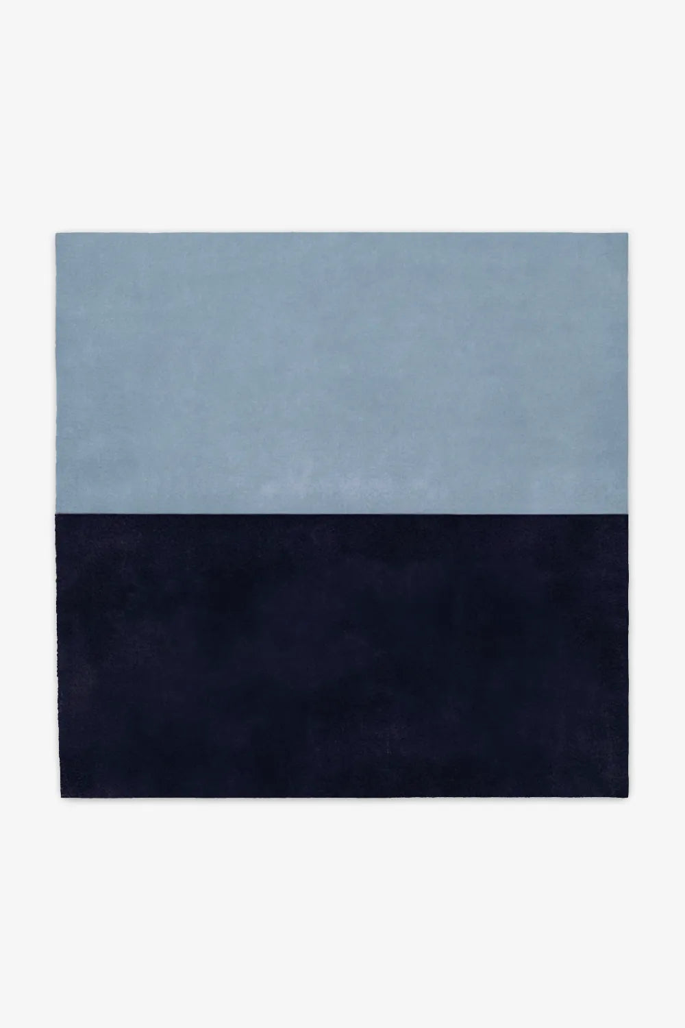 Two-tone blue and navy wool square rug available in 6x6 or 8x8, perfect for coastal modern homes, relaxed living rooms, or serene bedroom spaces.