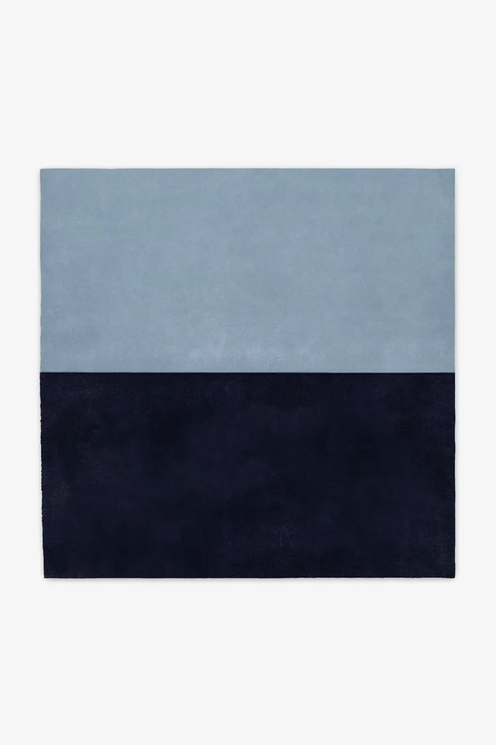 Two-tone blue and navy wool square rug available in 6x6 or 8x8, perfect for coastal modern homes, relaxed living rooms, or serene bedroom spaces indigo
