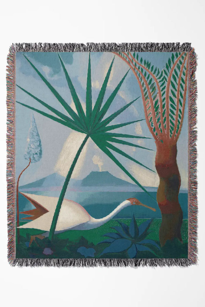 Blue scenic woven throw blanket with a tropical nature-inspired design.