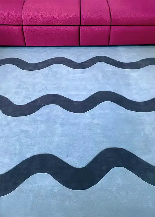 Hand-tufted blue rug with sculptural wavy stripes, perfect for modern 5x7 rugs, bold nursery rugs, or custom shaped wool rugs