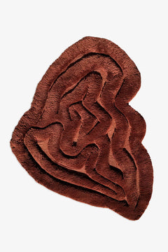 Modern irregular shaped large shag rug in warm brown with sculptural carved texture