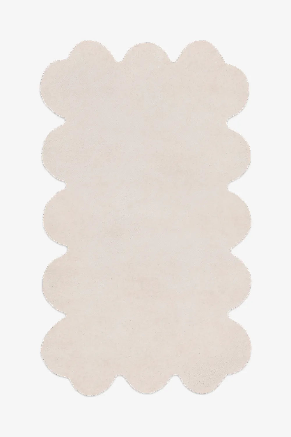 Cream scalloped wool rug in 5x8 size, hand-tufted and ideal for a neutral bedroom or cozy reading nook